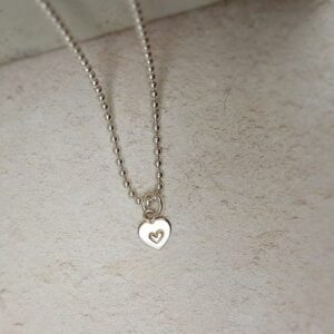 hand stamped sterling silver heart initial charm