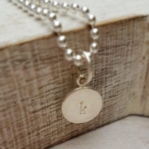 hand stamped sterling silver 9mm round initial charm