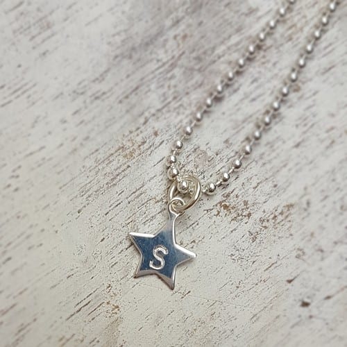 hand stamped sterling silver star charm